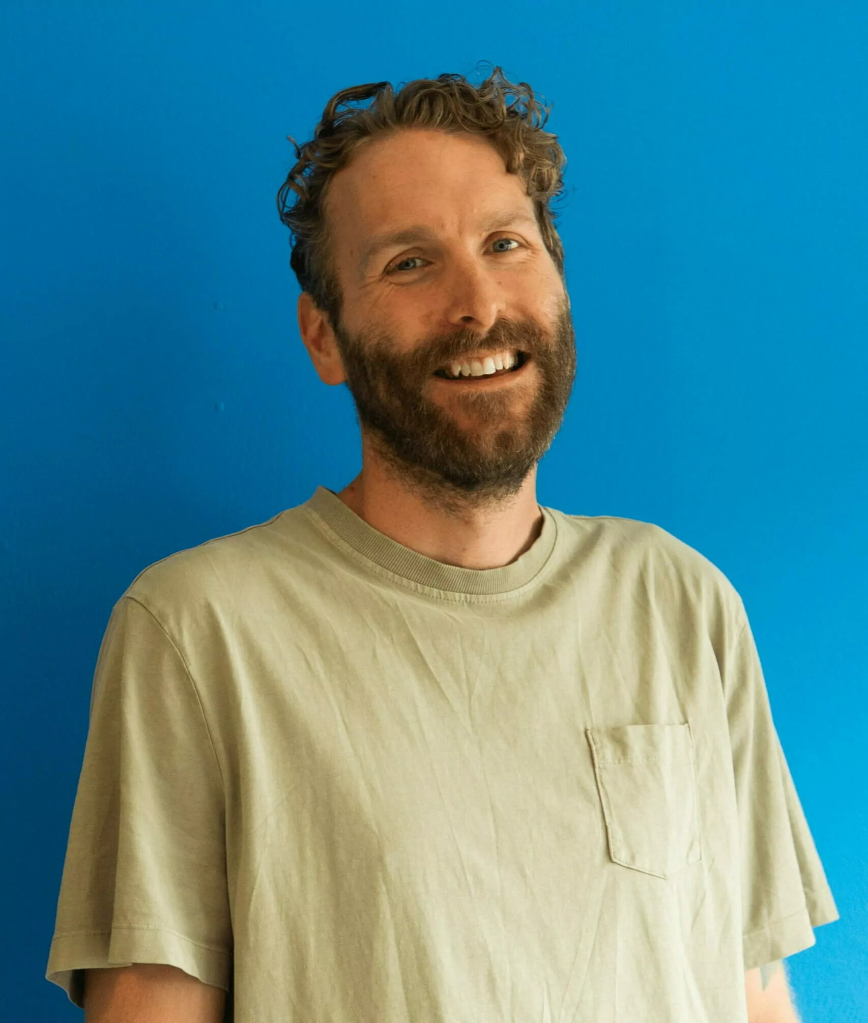 Antony infront of a blue background