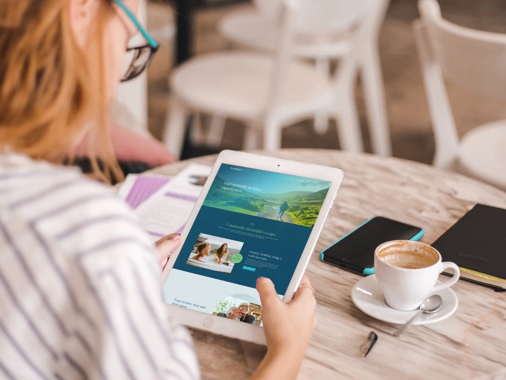 A woman engaged with a tablet, browsing a website, showcasing modern technology in daily life.