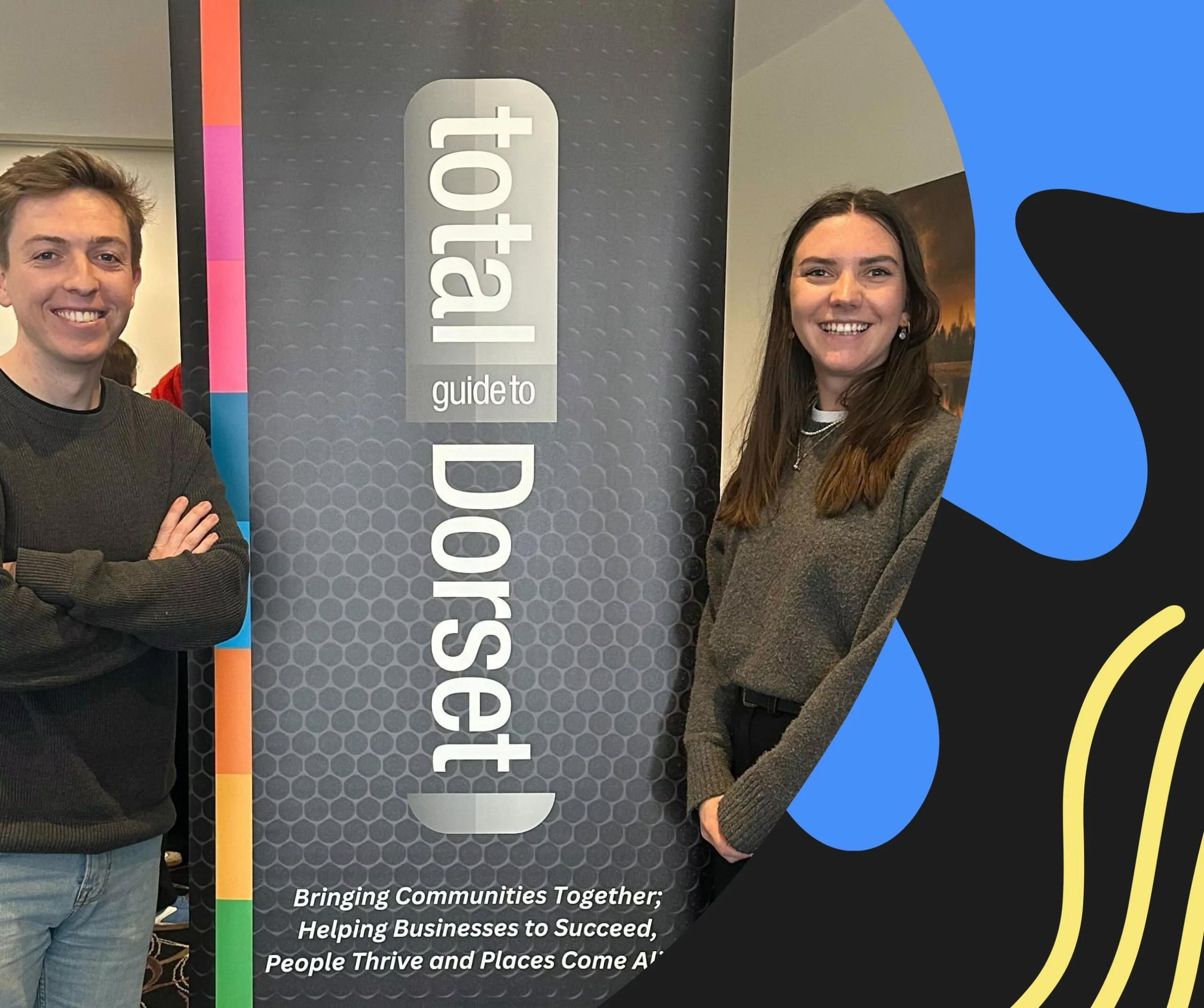 Megan and Oscar stand next to a "Total Dorset" banner during their participation in the Young Total Business Network.