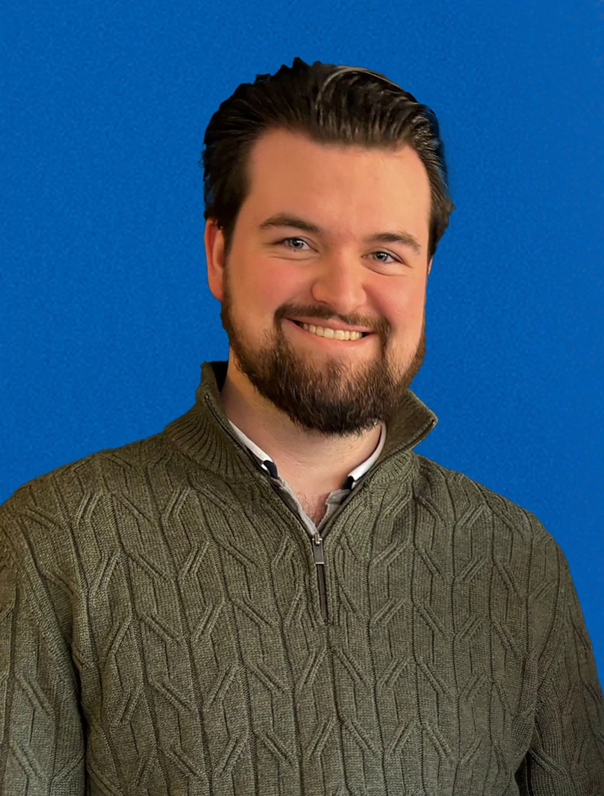 Alex D'Arcy-Smith on a blue background.