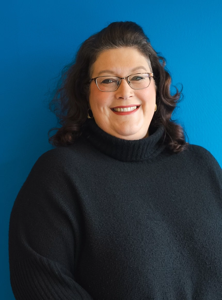Nicola Pratt on a blue background.