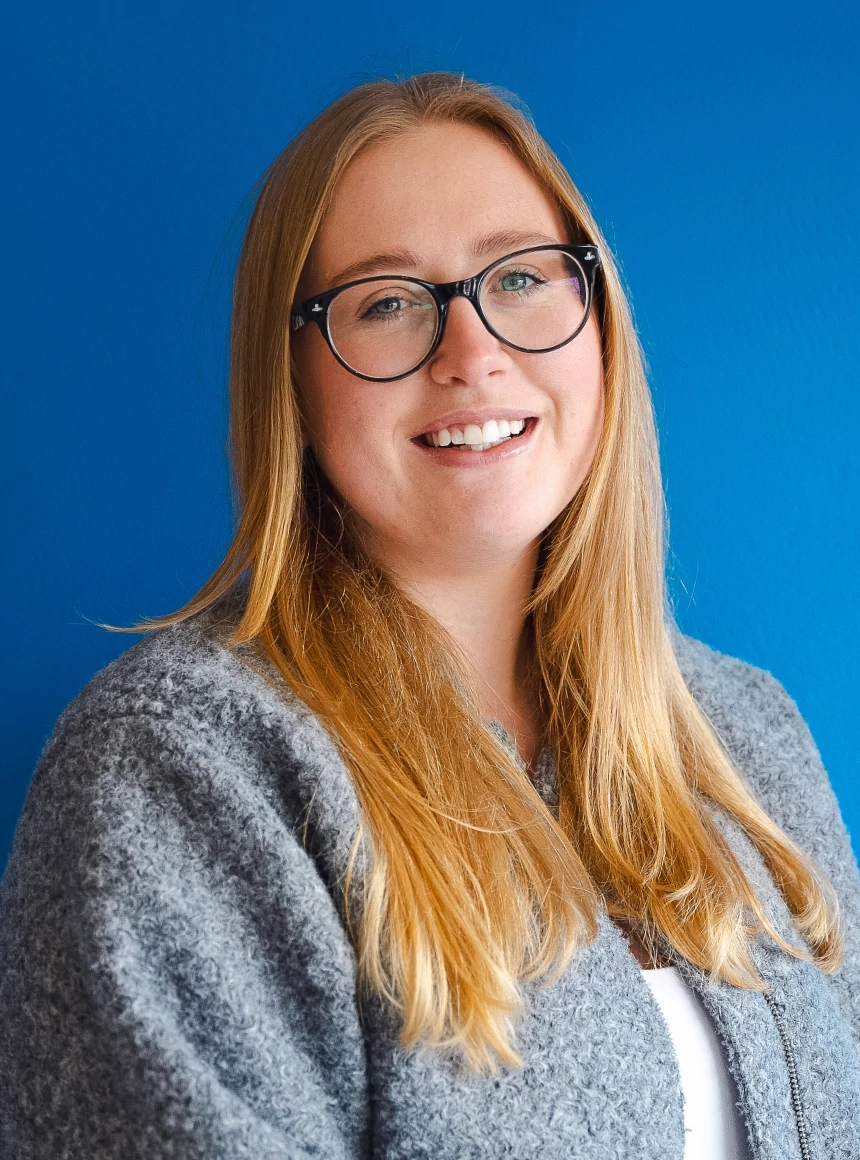 Tiffany Hibberd on a blue background.