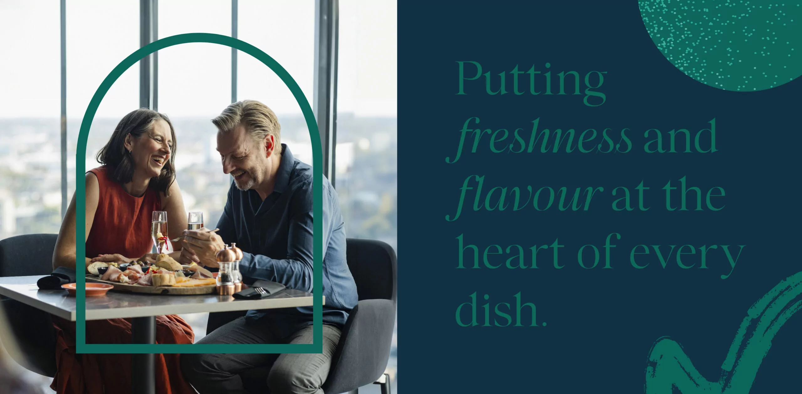 Elegant dining experience at Salt & Earth Bistro featuring a couple enjoying a charcuterie board with wine. The dark blue and green branding emphasizes the restaurant’s focus on freshness and flavour, with the tagline ‘Putting freshness and flavour at the heart of every dish’ elegantly displayed alongside the image.