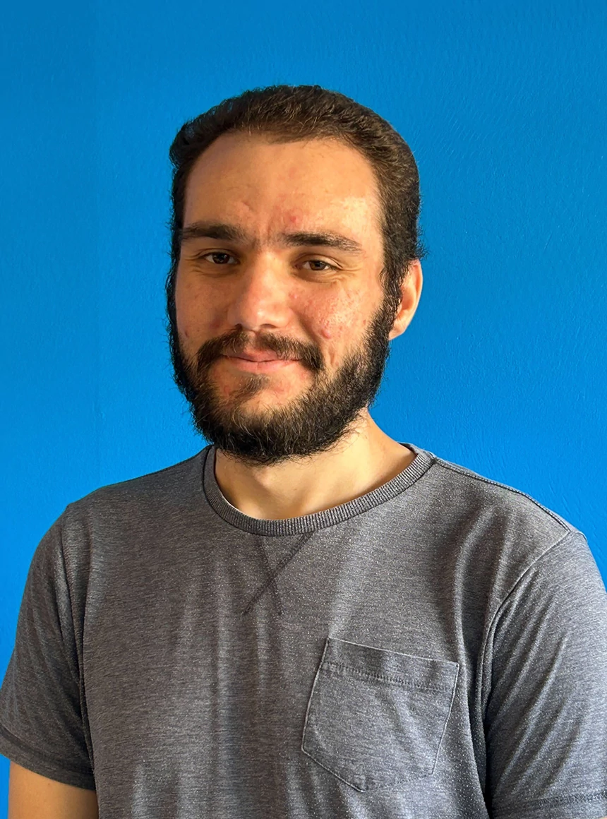 Louis Stallard-Phillips on a blue background.